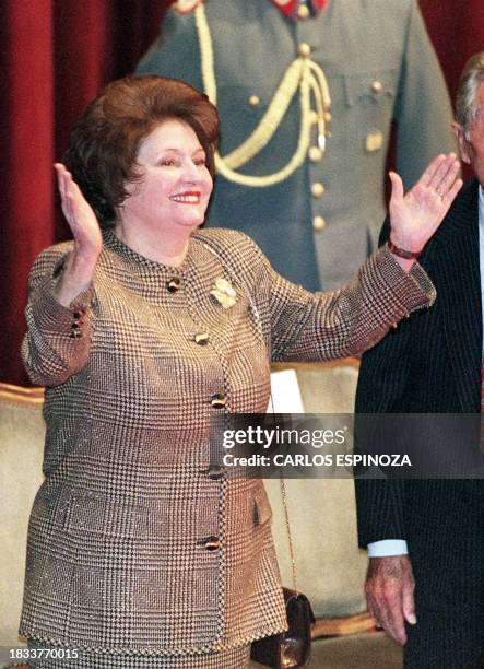 Lucia Hiriart, wife of General Augusto Pinochet, acknowledges supporters of the ex-dictator of Chile, 08 April 1999 at the military school in...