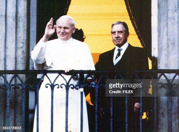 This 02 April 1987 file photo shows then-Chilean president and current army commander Gen. Augusto Pinochet with Pope John Paul II at the balcony of...