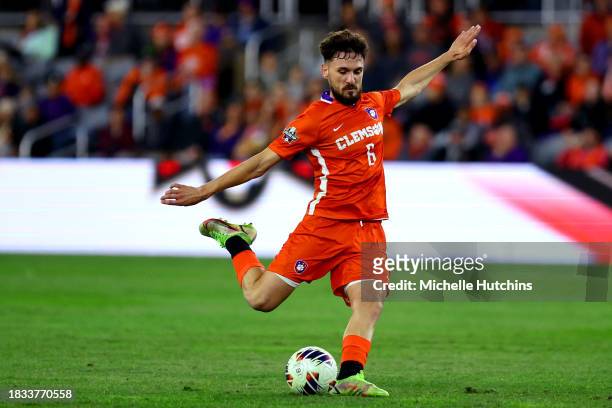 Joran Gerbet of the Clemson Tigers strikes the ball against the West Virginia Mountaineers during the Division I Men's Soccer Semifinals held at the...