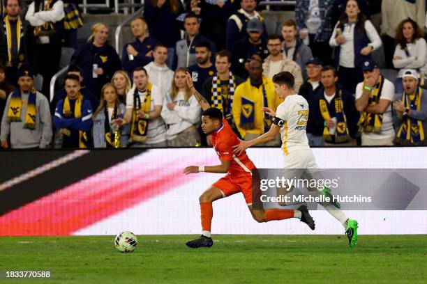 Ryan Baer of the West Virginia Mountaineers and Shawn Smart of the Clemson Tigers battle for the ball during the Division I Men's Soccer Semifinals...