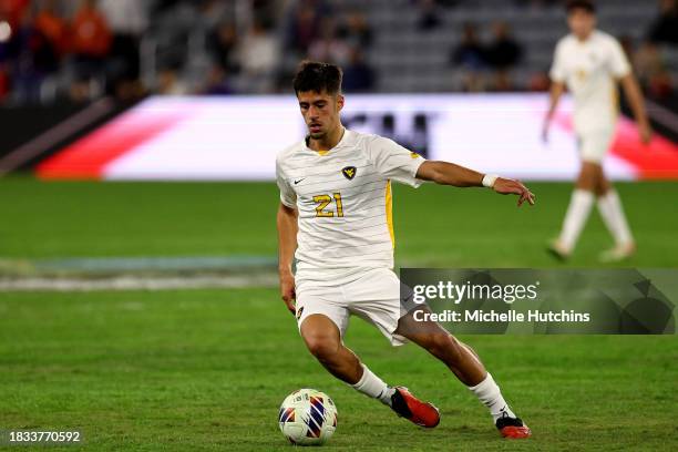 Constantinos Christou of the West Virginia Mountaineers controls the ball against the Clemson Tigers during the Division I Men's Soccer Semifinals...