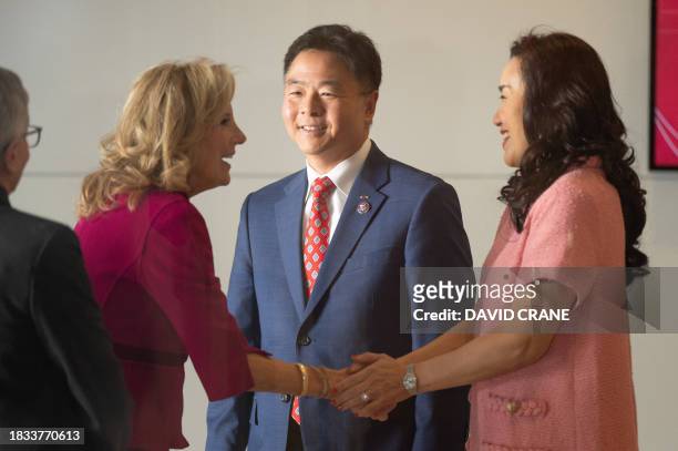First Lady Jill Biden is greeted by Congressman Ted Lieu and his wife Betty Lieu during a tour of the Van Eyk lab at Cedars-Sinai Medical Center in...