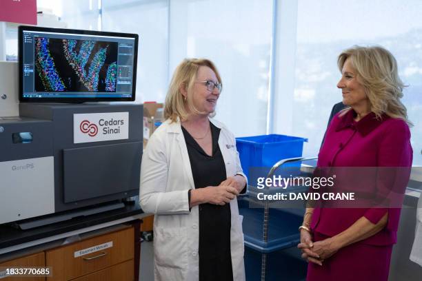 Doctor Jennifer Van Eyk explains lab studies to US First Lady Jill Biden during a tour of the Van Eyk lab at Cedars-Sinai Medical Center in Los...