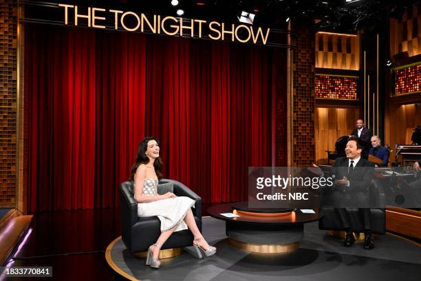 Episode 1887 -- Pictured: Actress Anne Hathaway and host Jimmy Fallon during "What's Behind Me" on Friday, December 8, 2023 --
