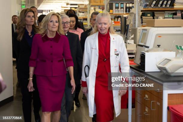 Doctor Noel C Bairey-Merz gives US First Lady Jill Biden a tour of the Van Eyk lab at Cedars-Sinai Medical Center in Los Angeles on December 8, 2023....