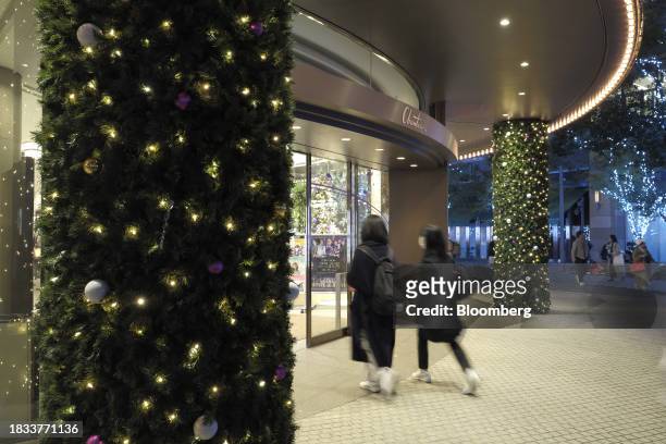 An entrance to Hibiya Chanter building is decorated with Christmas lights in the Yurakucho area of Tokyo, Japan, on Friday, Japan, on Dec. 8, 2023....