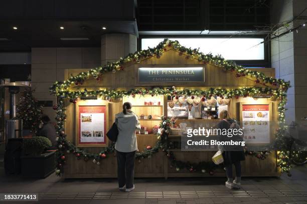 Pop up stall decorated with Christmas lights in the Yurokucho area of Tokyo, Japan, on Friday, Japan, on Dec. 8, 2023. Inflation data are well above...