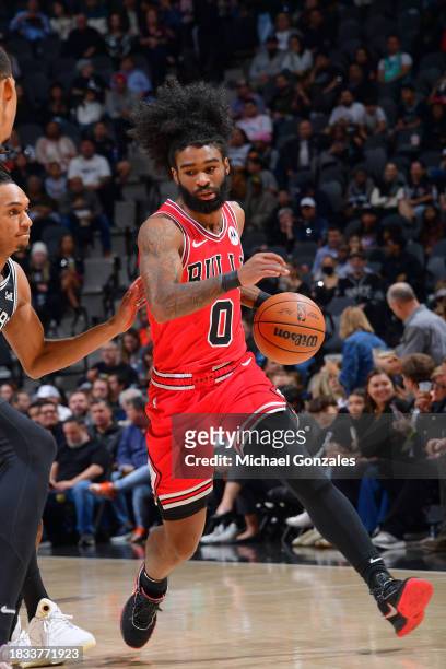 Coby White of the Chicago Bulls drives to the basket during the game against the San Antonio Spurs on December 8, 2023 at the Frost Bank Center in...