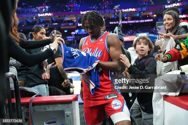 Tyrese Maxey of the Philadelphia 76ers signs autographs after the game against the Atlanta Hawks on December 8, 2023 at the Wells Fargo Center in...