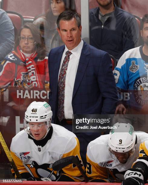 Head coach Mike Sullivan of the Pittsburgh Penguins looks on during third period action against the Florida Panthers at the Amerant Bank Arena on...