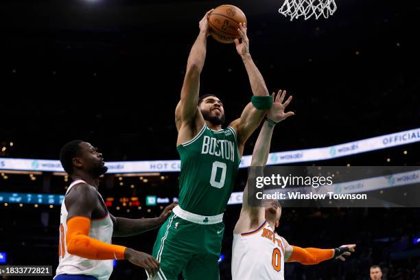 Jayson Tatum of the Boston Celtics goes to the basket between Julius Randle of the New York Knicks and Donte DiVincenzo during the second half at TD...