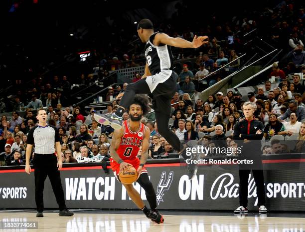 Malaki Branham of the San Antonio Spurs can't stop Colby White of the Chicago Bulls from making a three in the second half at Frost Bank Center on...