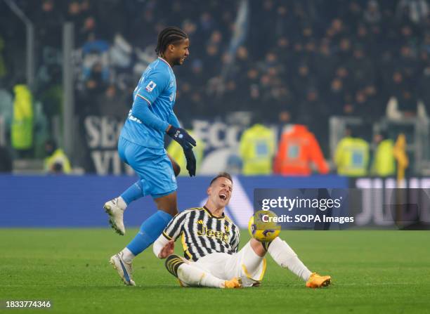 André-Frank Zambo Anguissa of Napoli and Arkadiusz Milik of Juventus seen in action during the match between Juventus FC and Napoli as part of...