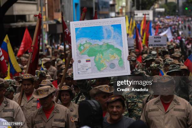 Chavismo supporters march in support of President Maduro in the dispute with Guyana over the Essequibo territory, in Caracas, Venezuela on December...