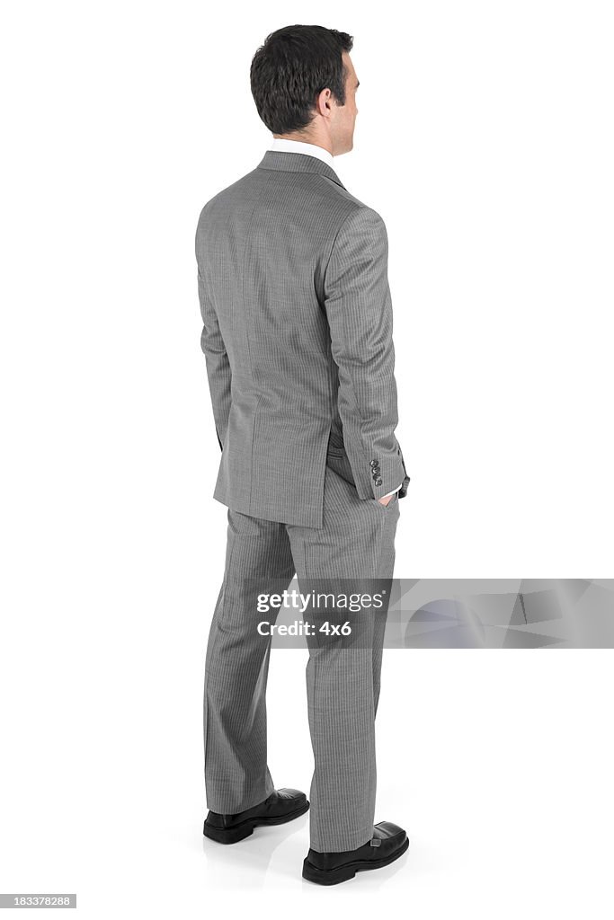 Businessman with hands in pockets