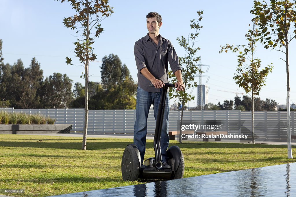 Man riding on segway.