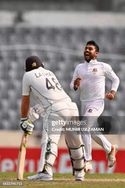 Bangladesh's Mehidy Hasan Miraz celebrates after taking the wicket of New Zealand's Tom Latham during the fourth day of the second Test cricket match...