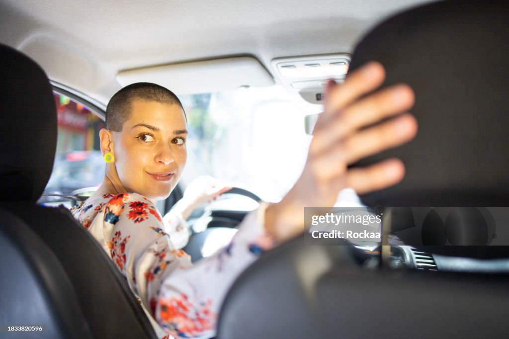 Woman is driving a car on her way to work