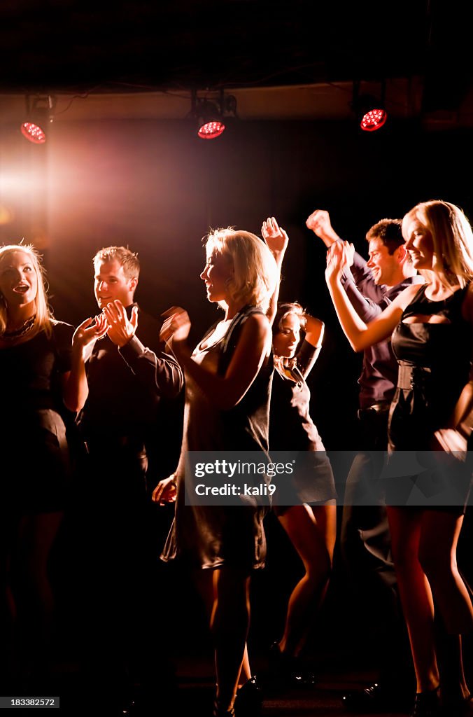 Silhouette of people dancing in nightclub