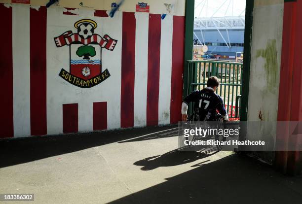 Fan in a wheelchair makes his way to the ground prior to the Barclays Premier League match between Southampton and Swansea City at St Mary's Stadium...