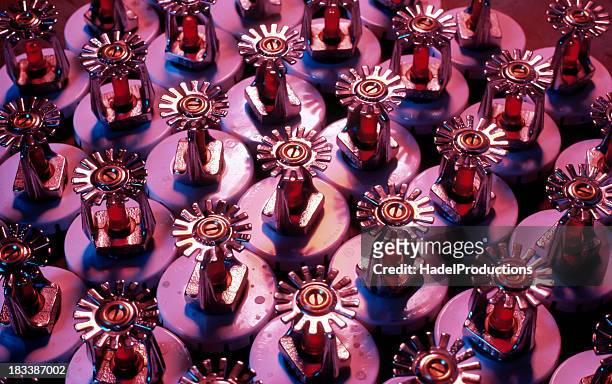 fire sprinklers ready for installation - fire sprinkler stock pictures, royalty-free photos & images