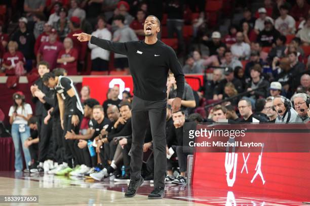 Head coach Kim English of the Providence Friars signals to his players in the first half during a college basketball game against the Oklahoma...
