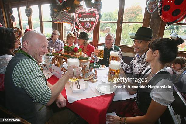 Pep Guardiola , head coach of Bayern Muenchen attends with his wife Cristina Serra , Karl-Heinz Rummenigge , CEO of Bayern Muenchen and Matthias...