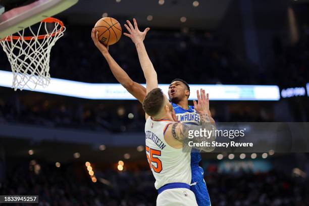 Giannis Antetokounmpo of the Milwaukee Bucks drives to the basket against Isaiah Hartenstein of the New York Knicks during the first half of the NBA...