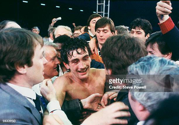 Barry McGuigan of Northern Ireland celebrates after beating WBA Champion Eusebio Pedroza of Panama at Loftus Road Stadium,London on the 8th of June...