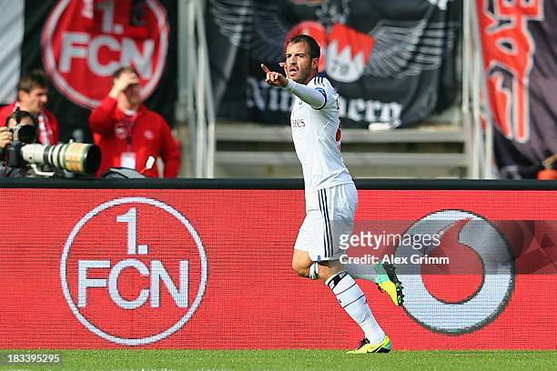 Rafael van der Vaart of Hamburg celebrates his team's first goal during the Bundesliga match between 1. FC Nuernberg and Hamburger SV at Grundig...