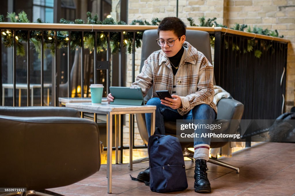 Non-Binary Professional Juggling Phone and Tablet with Ease