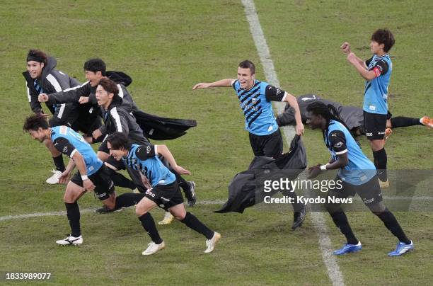 Kawasaki Frontale players react after a penalty shootout win over Kashiwa Reysol in the Emperor's Cup football final on Dec. 9 at Tokyo's National...