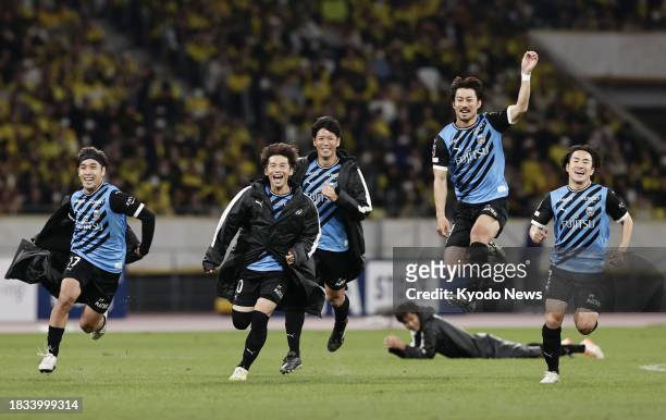 Kawasaki Frontale players celebrate after a penalty shootout win over Kashiwa Reysol in the Emperor's Cup football final on Dec. 9 at Tokyo's...