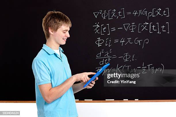 young male student using tablet computer for math in classroom - resourceful bildbanksfoton och bilder