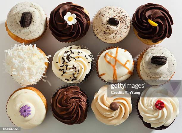 cupcake selection variety with fancy gourmet topping, top overhead view - chocolate top view stockfoto's en -beelden