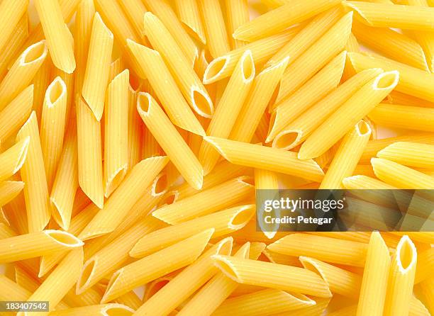 raw pasta (penne) - penne stock pictures, royalty-free photos & images