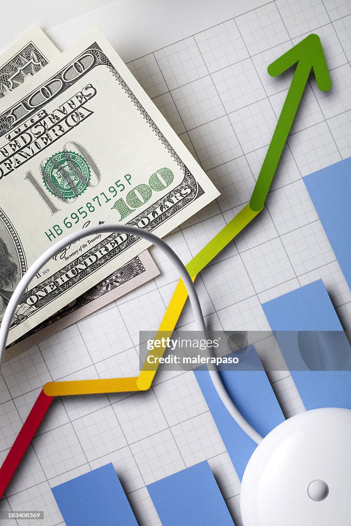 Financial Planning. Graph with a mouse and dollar banknotes.