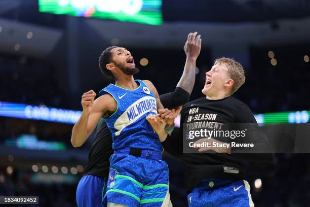 Cameron Payne of the Milwaukee Bucks celebrates with AJ Green following a three point shot against the New York Knicks during the second half of the...