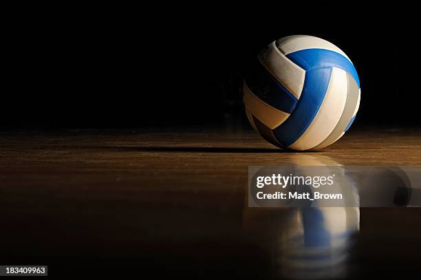 volleyball on wood floor - volleyball player stock pictures, royalty-free photos & images