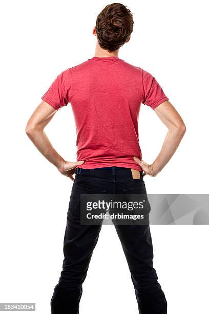 rear view of young man with hands on hips - handen op de heupen stockfoto's en -beelden