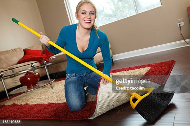 cleaning house - sweeping dirt under the rug - sweeping stock pictures, royalty-free photos & images