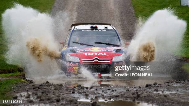 Sebastien Loeb of France drives his Citroen C4 through the 'Margam Park' stage on the fourth day of the Wales Rally GB in central Wales on November...