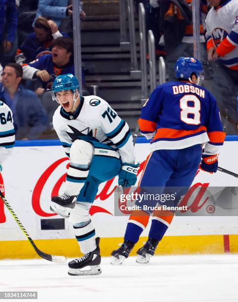 William Eklund of the San Jose Sharks scores the game-winning goal in overtime against Ilya Sorokin of the New York Islanders at UBS Arena on...