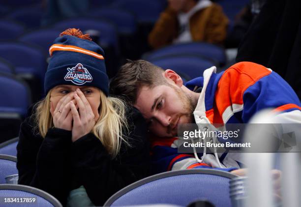 New York Islanders fans react after the team loses to the San Jose Sharks after holding a 4-1 lead during the third period at UBS Arena on December...