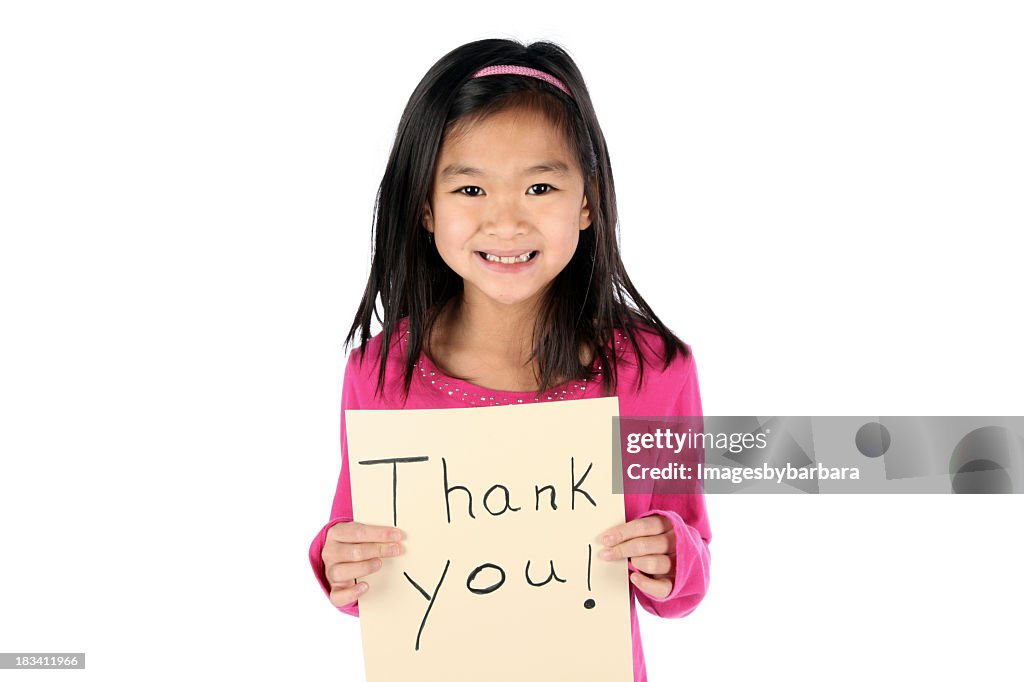 Young Asian girl holding a thank you sign