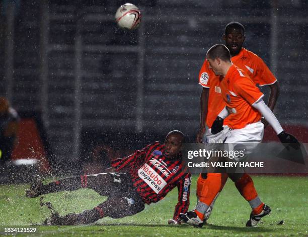 Nice's forward Nomwaya Habib Bamogo vies with Grenoble's midfielder Albert Baning during their French L1 football match Nice vs Grenoble, on December...