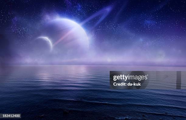 futuristic evening seascape - saturn planet stock pictures, royalty-free photos & images