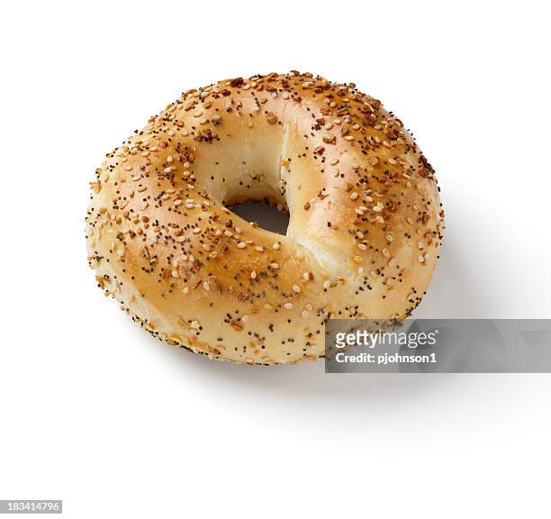 bagel with sesame and poppy seeds on white background - bagels stock pictures, royalty-free photos & images