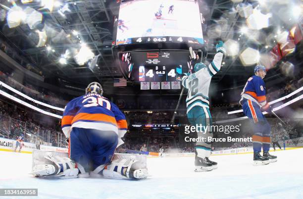 William Eklund of the San Jose Sharks scores the game-winning goal in overtime against Ilya Sorokin of the New York Islanders at UBS Arena on...