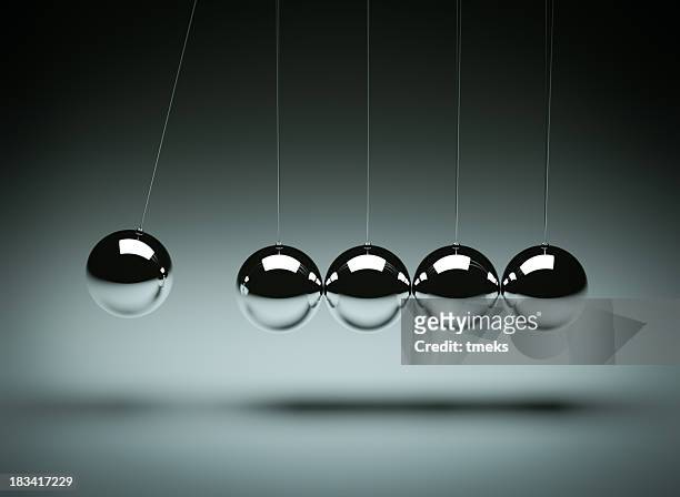 balancing balls newton's cradle - sphere stock pictures, royalty-free photos & images